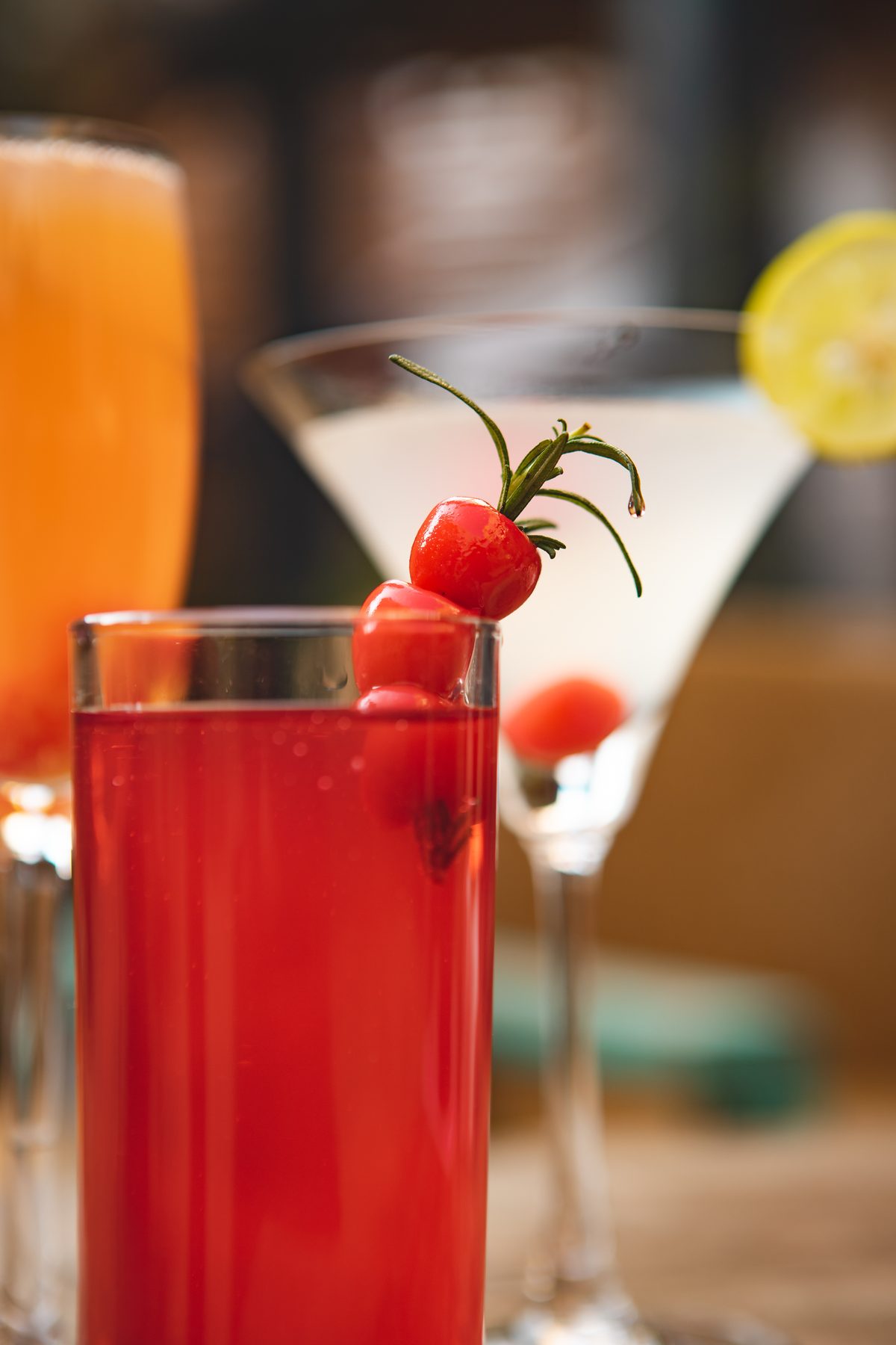 Signature cocktails at Jharana Bar, garnished with cherries and a sprig of rosemary