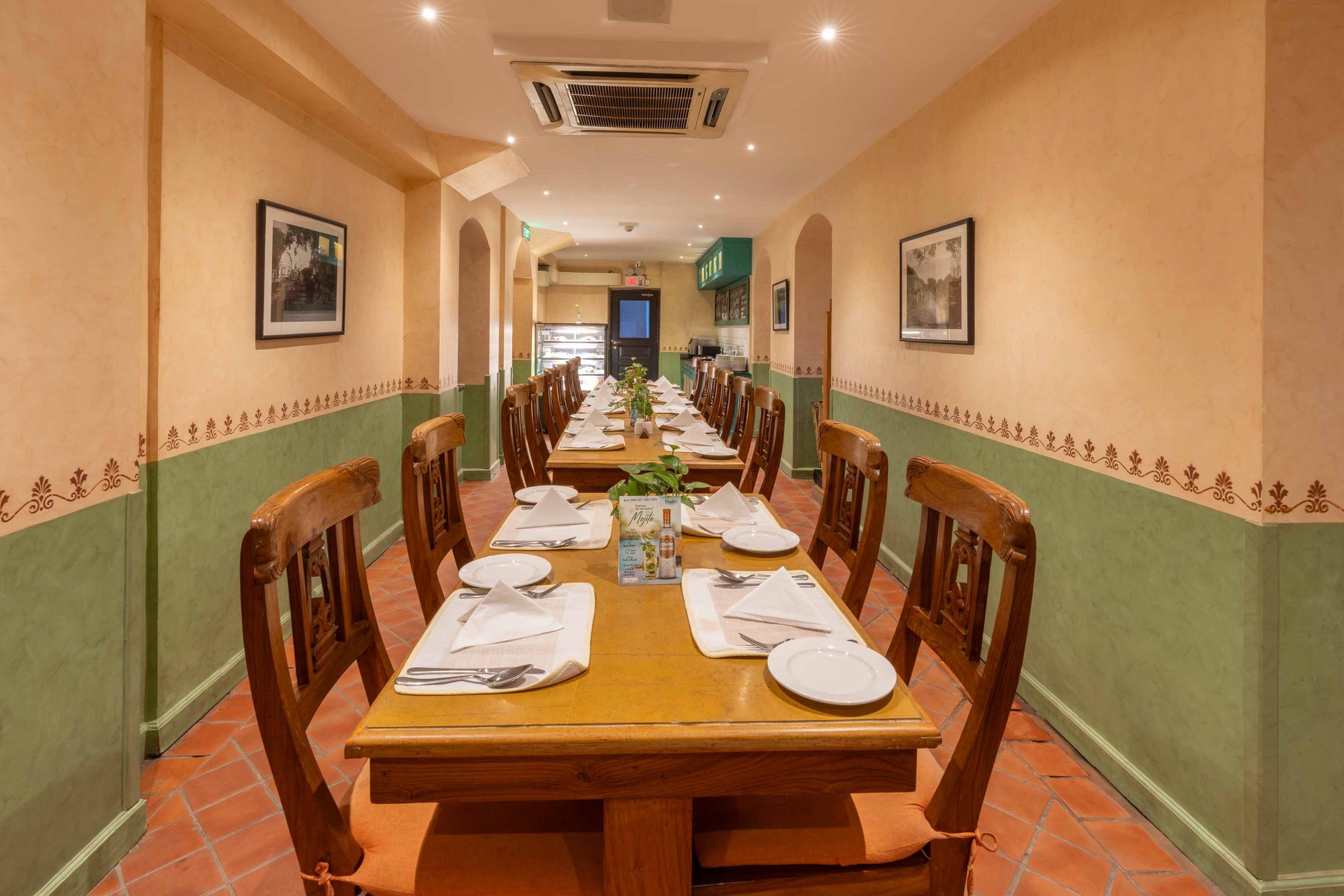 The inner dining area at Chiya Pasal set for a long table of guests