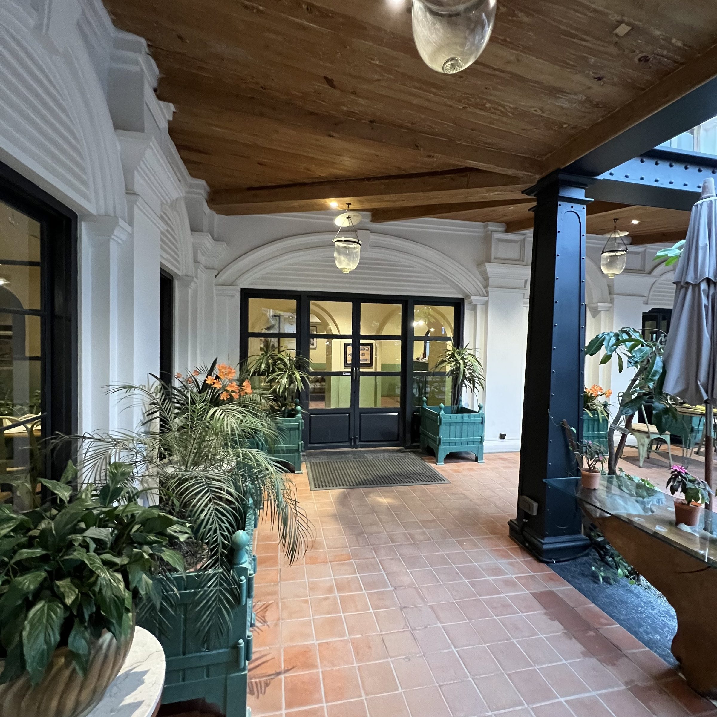 Carved columns and arches at Nepali Ghar Hotel